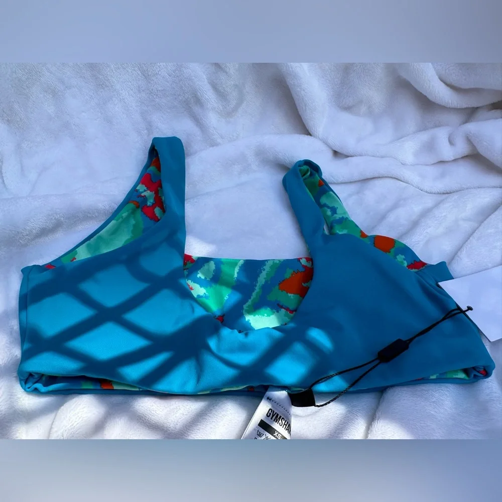 NWT- Gymshark blue/green/red reversible bikini‎ top.